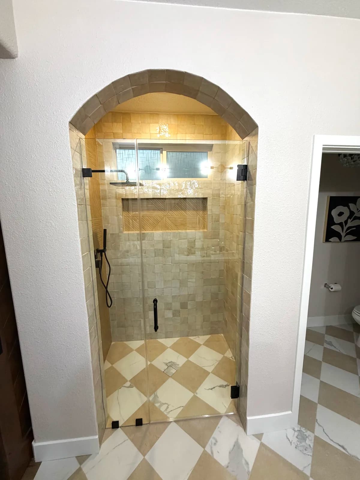 After: arched walk-in shower with zellige-style tile and checkerboard marble bathroom floor in El Dorado Hills, CA