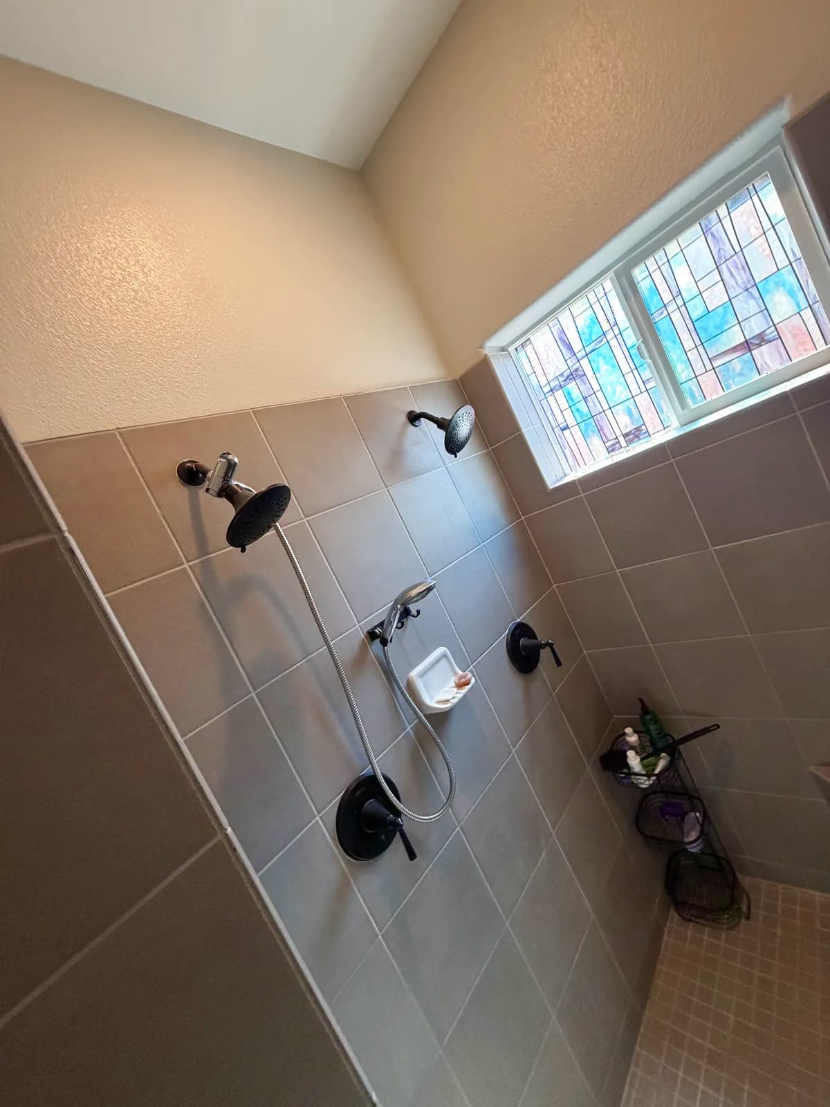 Before: Roseville bathroom shower exterior tile wall and old framed glass door jamb that limited entry width