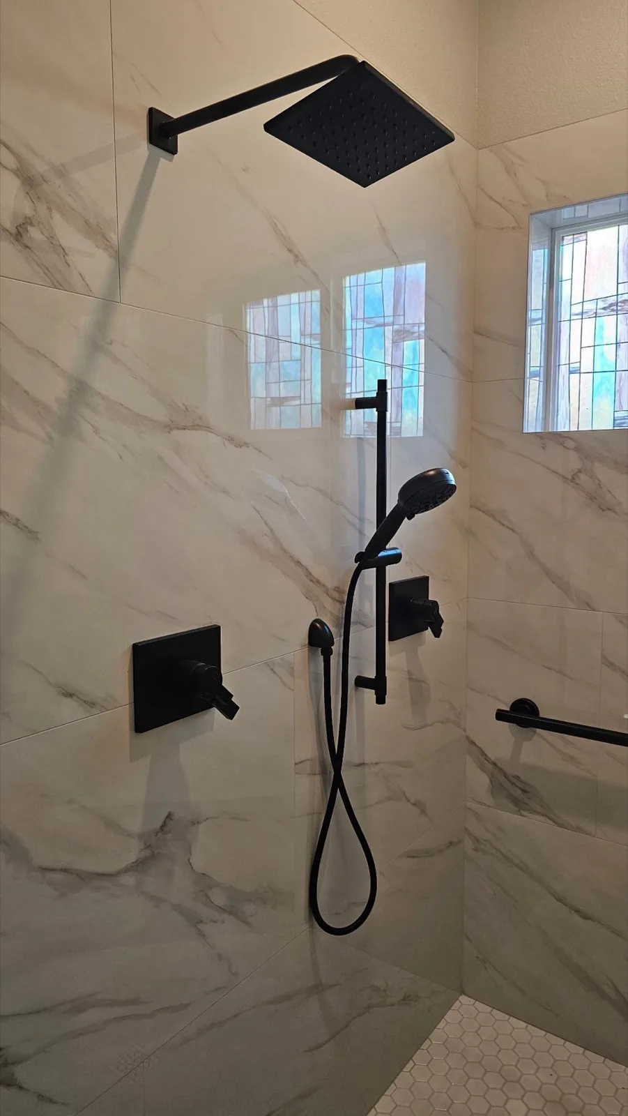 After: Roseville shower dual matte black shower system — square rain head on wall arm and handheld on slide bar with separate control valves