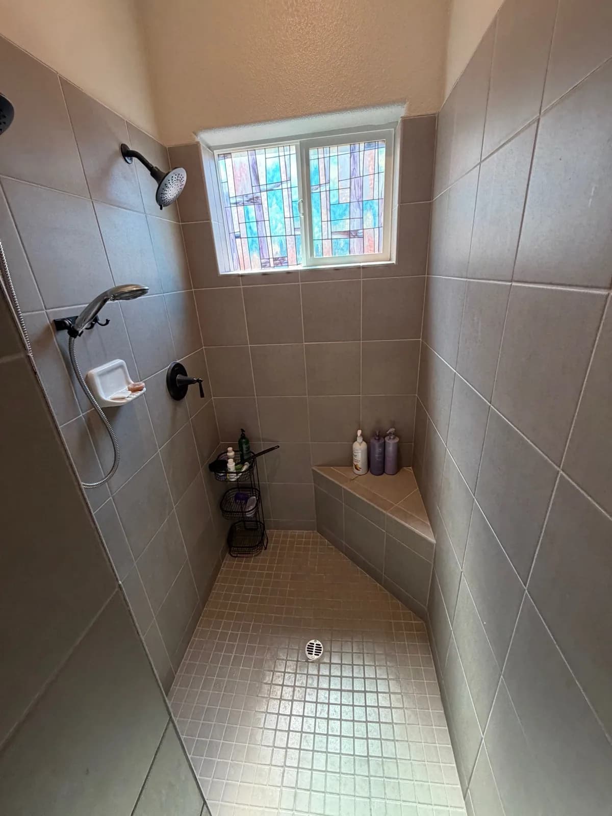 Before: Roseville bathroom showing the wall that was removed to create wheelchair-accessible shower entry