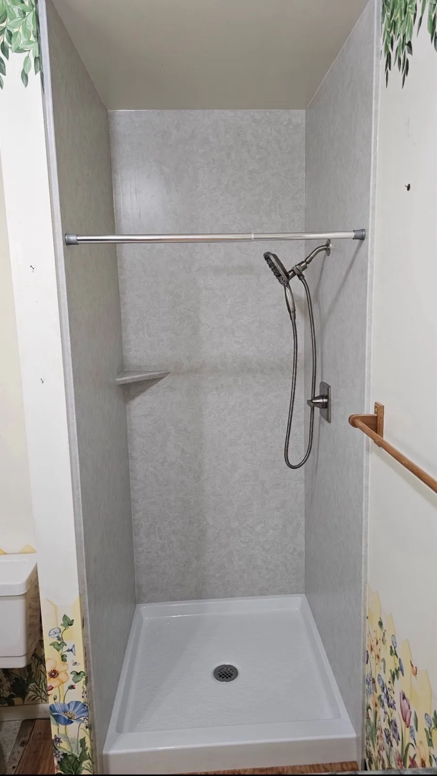 After: Roseville second acrylic shower — grey acrylic wall panels, corner shelf and handheld shower on slide bar