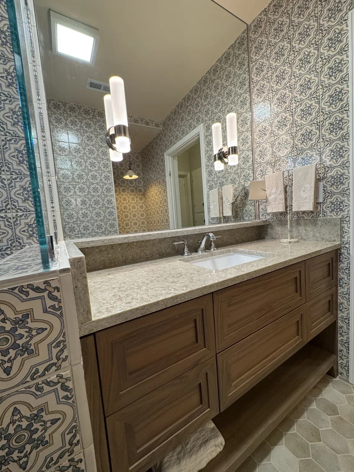After: Arden shower interior showing chrome handheld shower and separate shower valve on vintage Moroccan tile