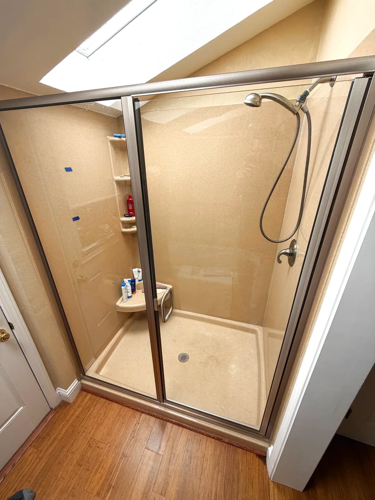 Before: fiberglass shower pan and surround with the door open