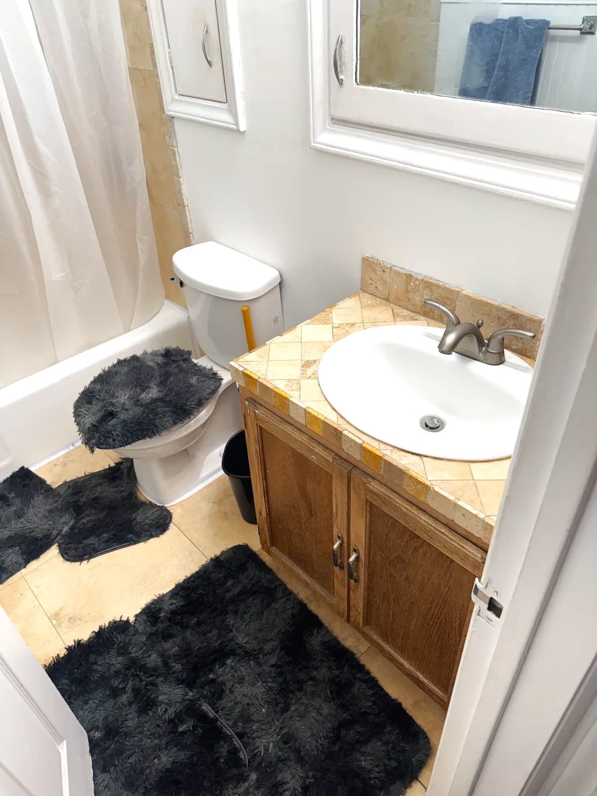 Before: Citrus Heights bathroom with laminate vanity, toilet and beige floor tile