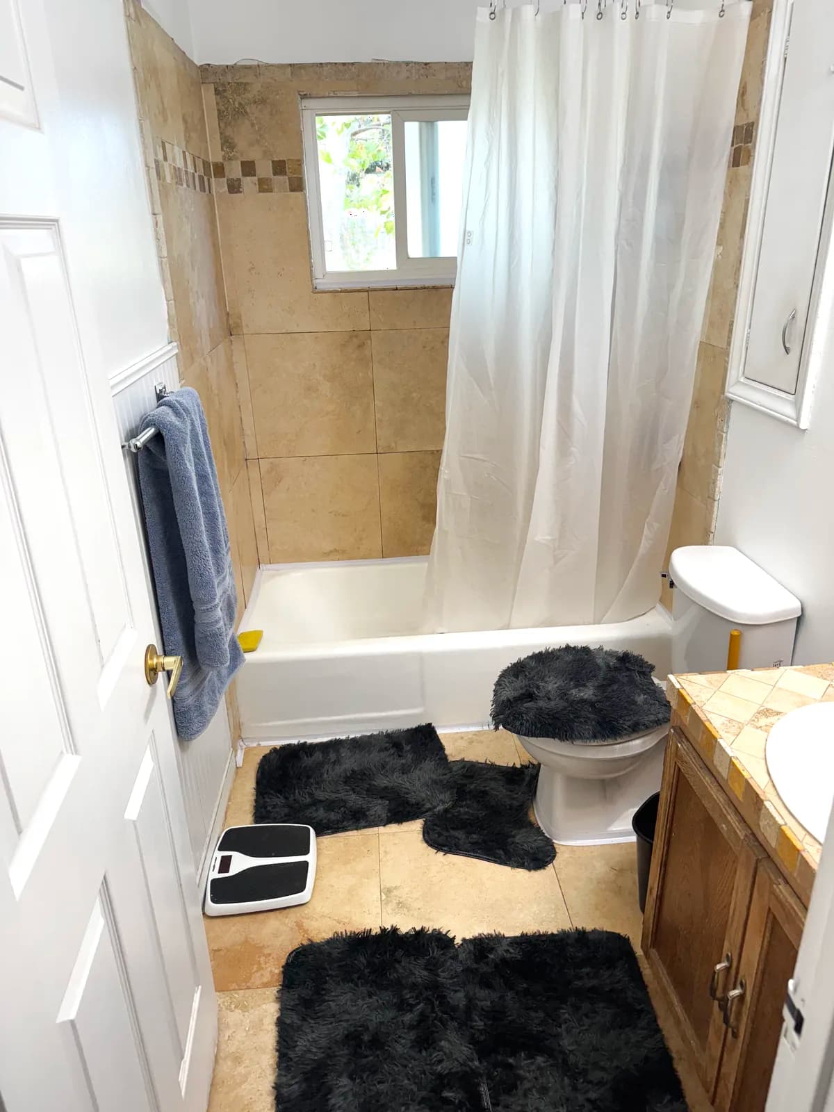 Before: tub with a shower curtain in a small Citrus Heights bathroom